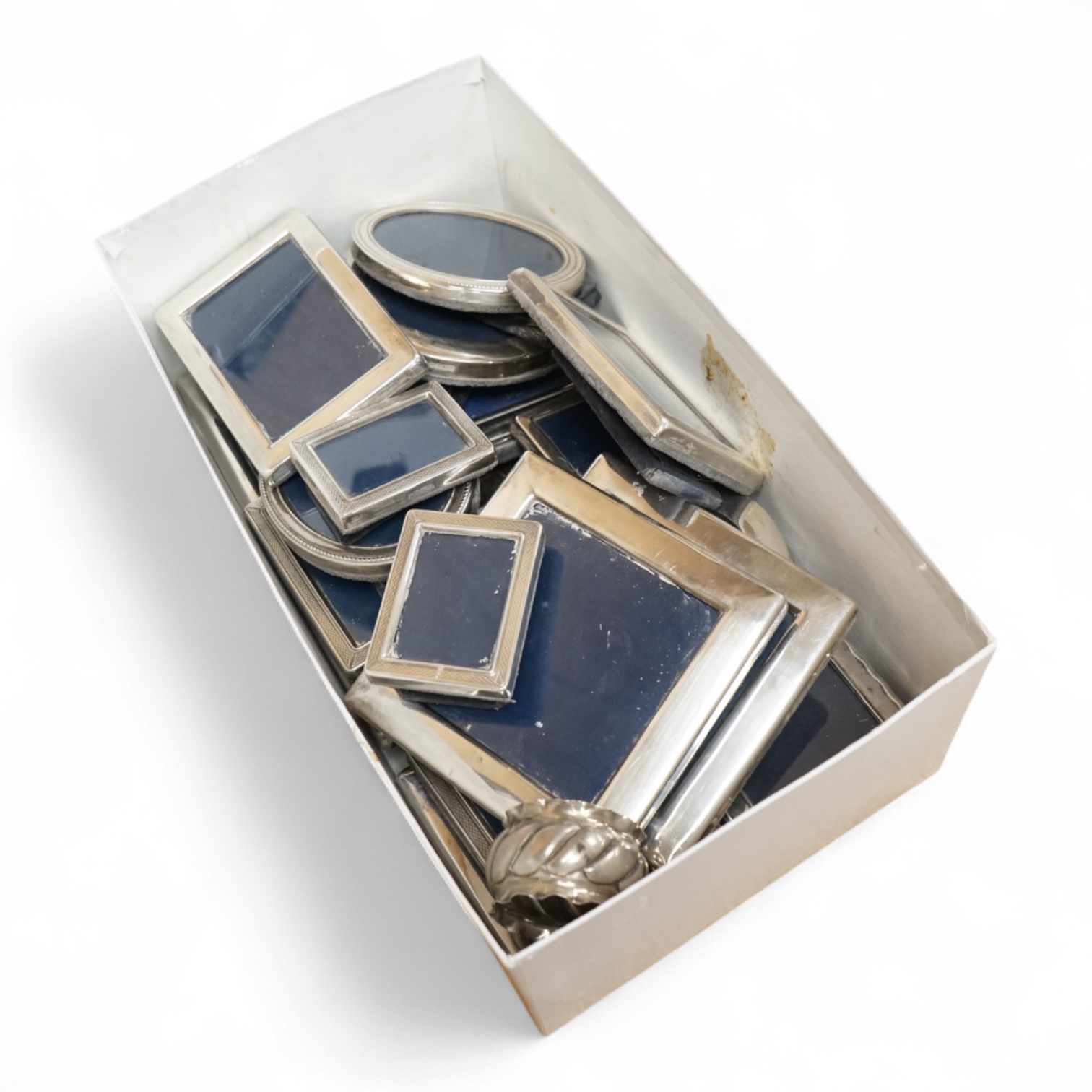 Four assorted pairs of modern silver mounted photograph frames, including Carr's Of Sheffield, 1992/3 and 1990, together with twelve other small assorted modern silver mounted photograph frames, largest 12.9cm and a silv